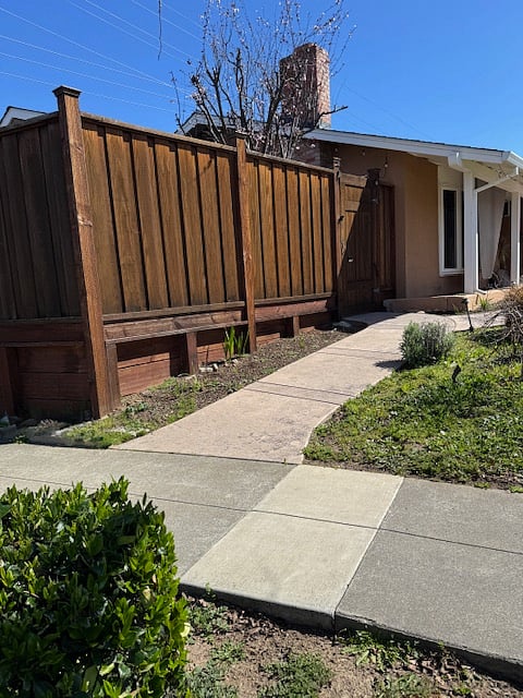Walkway to gate entrance from street parking.