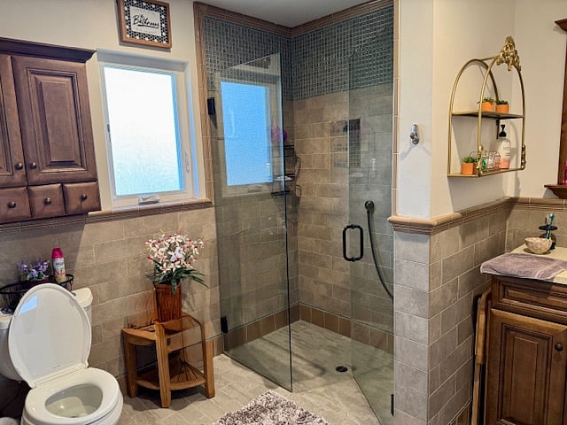 Curbless shower with glass double doors.