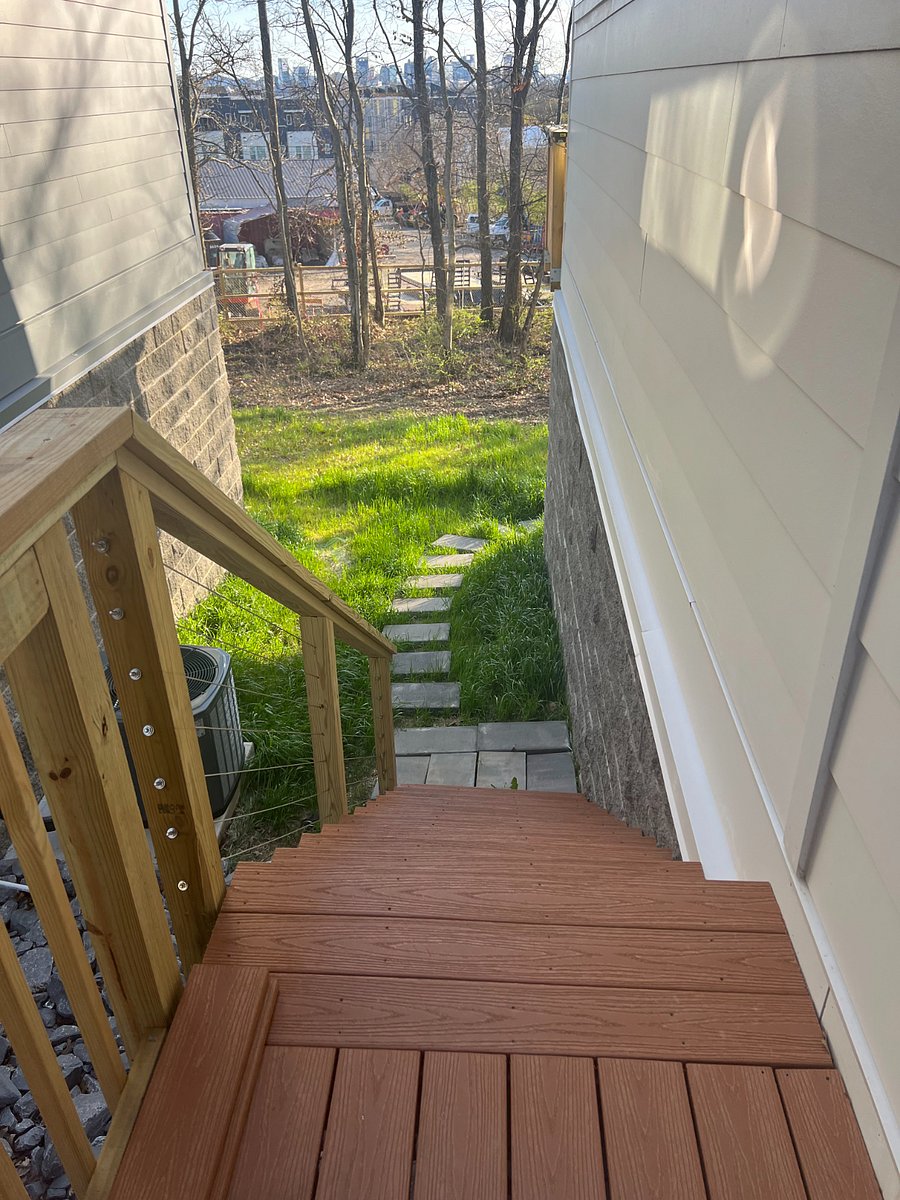 The private entrance to the apartment is accessible by an exterior staircase that features adequate exterior lighting including motion detector sensors.
