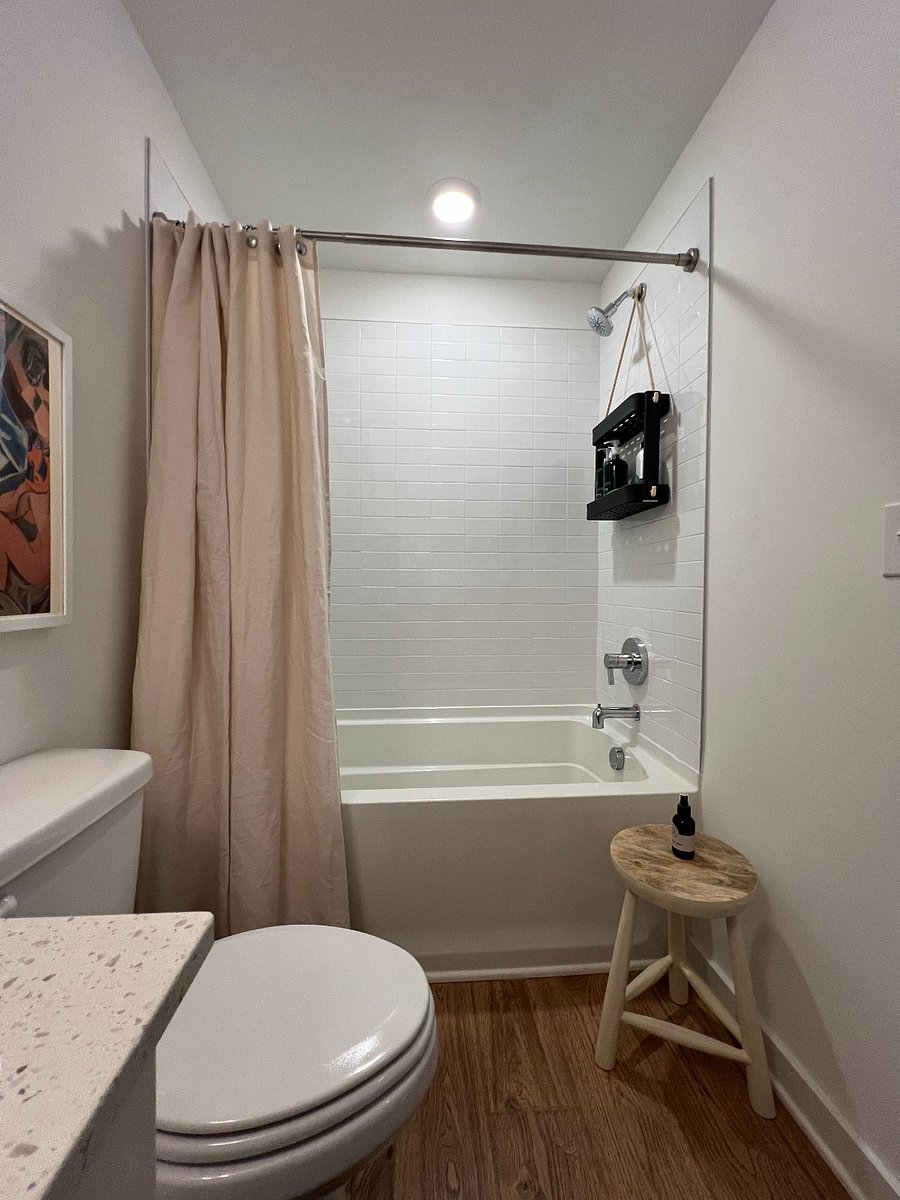Full bath features shower with deep soaking tub.