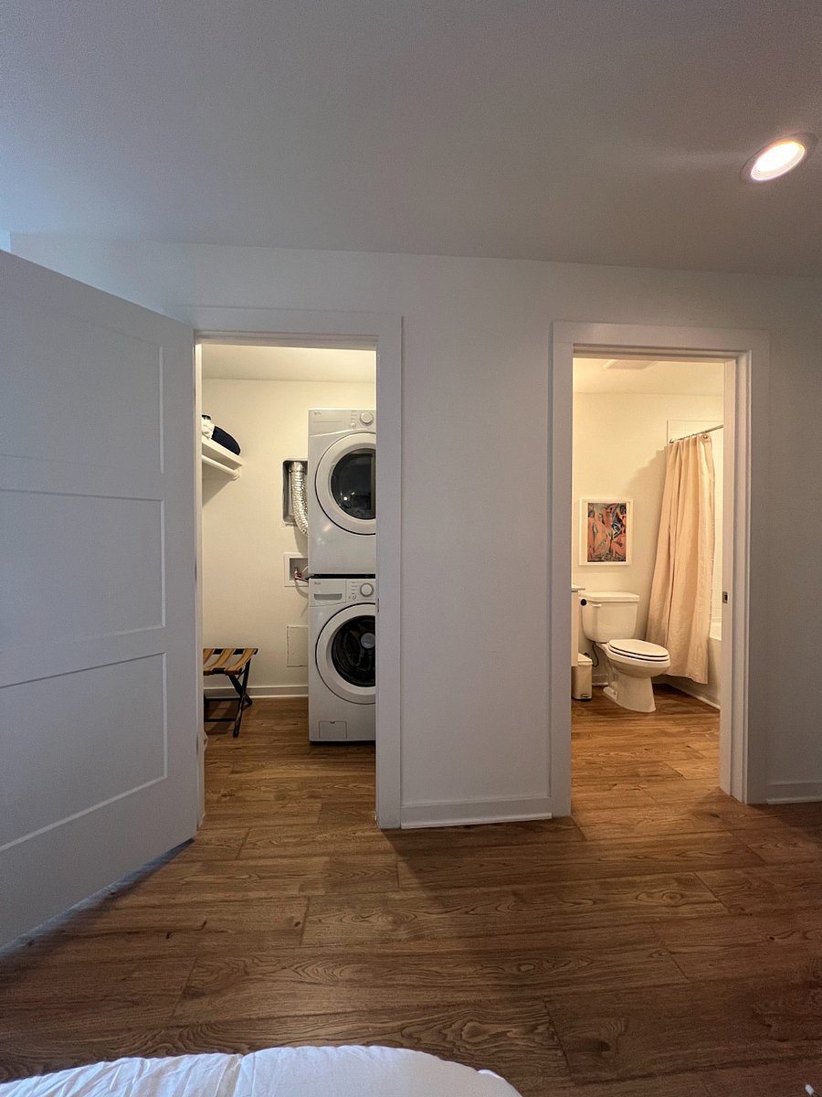 View from the queen bed looking into the master closet and bathroom.