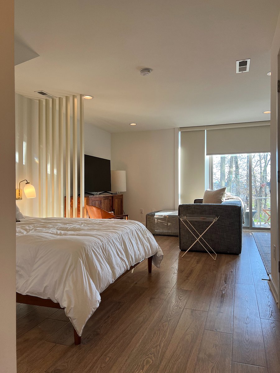 Cozy lighting detail including bedside sconces located throughout the apartment.