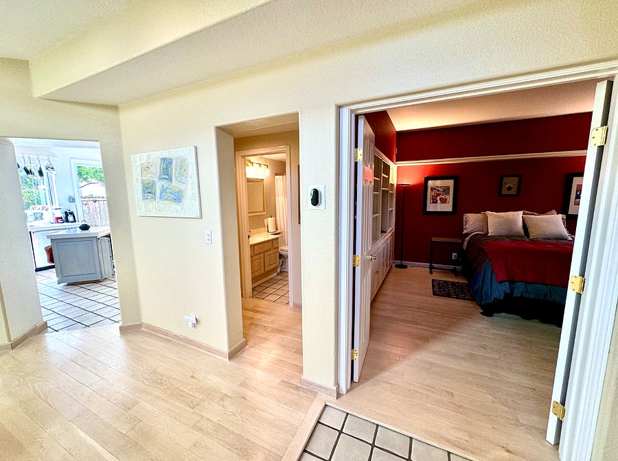 View of downstairs Full BR with adjacent shared full bathroom, convenient to kitchen and common living areas downstairs.
