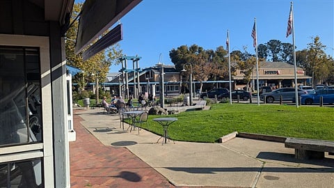 15 min walk along paved lagoon walk/bike trail (no cars) to shopping & restaurants (pizza, Mexican food, sushi, Chinese food, cafe, Safeway grocery store).  Starbucks across the street.