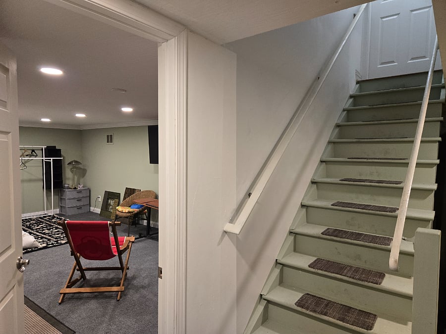 You'll use our basement stairs to get to your private room, with 10 adjustable ceiling lights, electric outlets on every wall, a clothes rack and shoe organizer, and a clothes storage rack and draws.