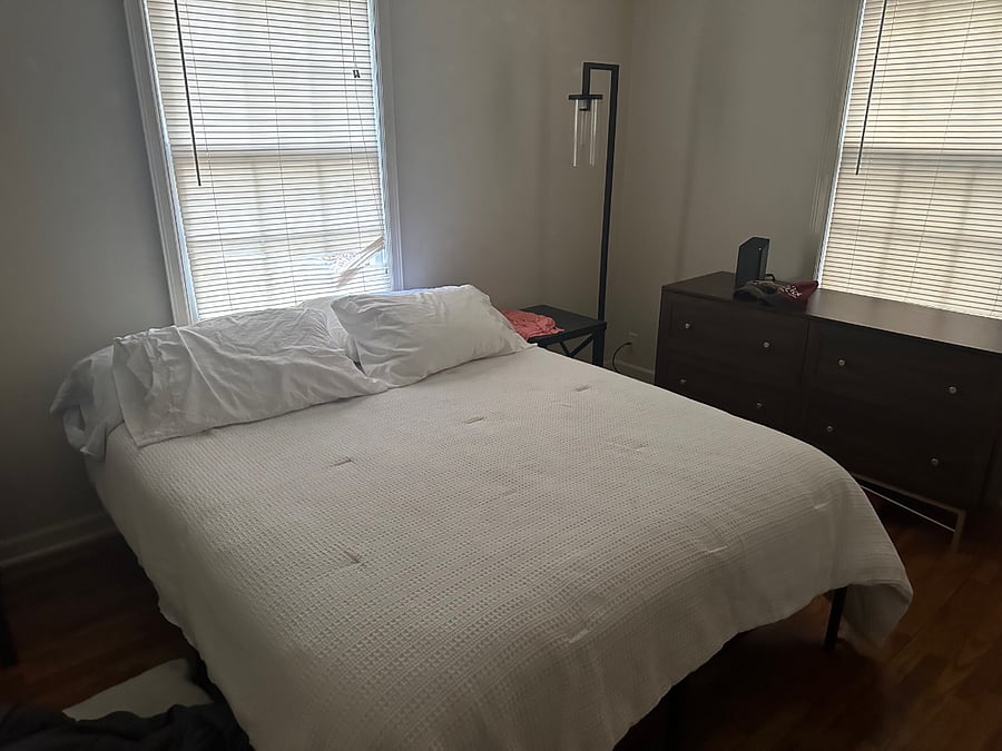 Master bedroom with night tables, lamps and dresser, black out drapes not shown