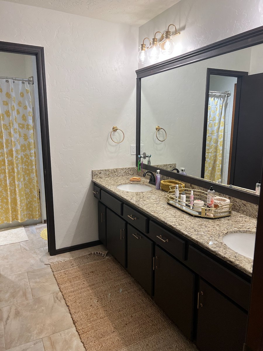 Bathroom with entrances from both bedrooms, tub, shower, and toilet. 