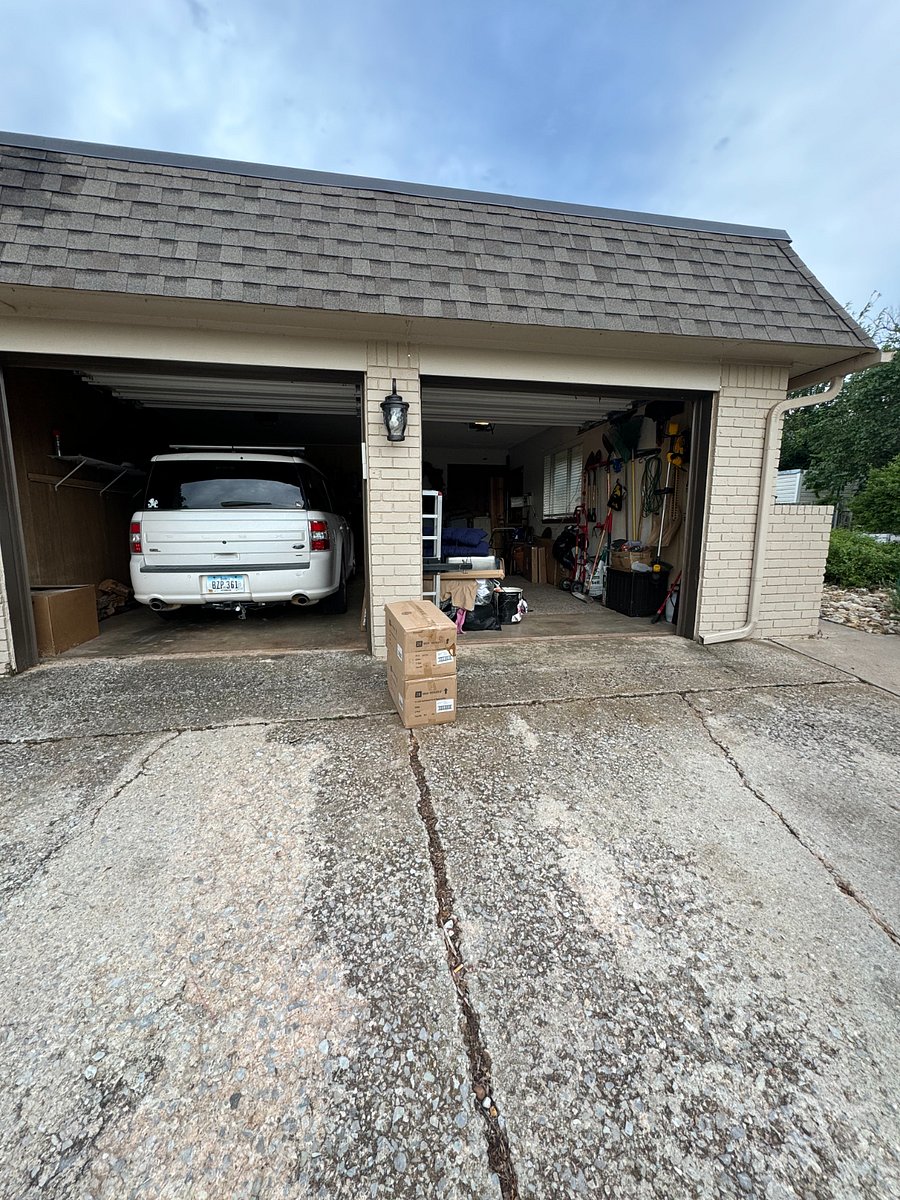 2 stall garage parking with driveway that can also park 2 vehicles.