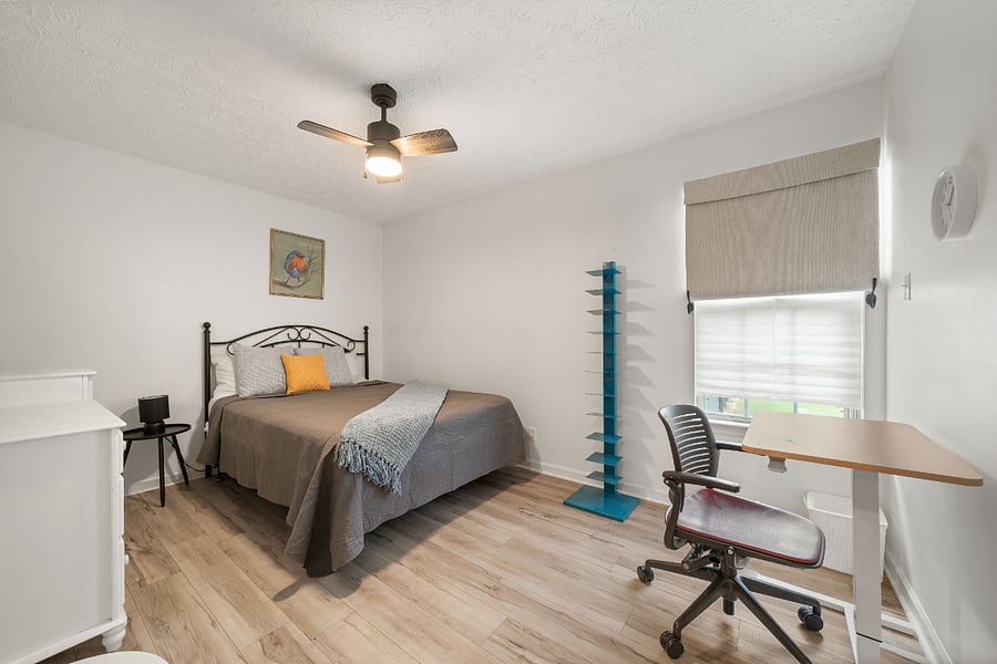 Third Bedroom with a Queen Bed and an office space for work and study.