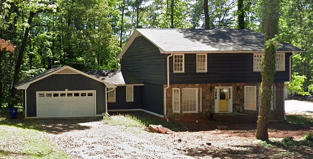 Exterior of house. Property is on 1/2 acre lot.  Deck and patio in the back yard.