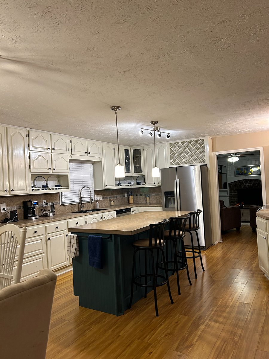 Kitchen view toward sink from breakfast area