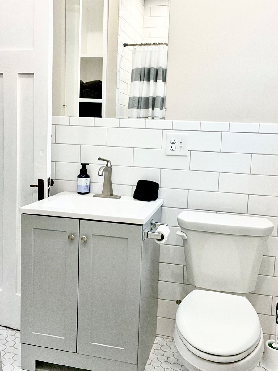 Stunning white tile bathroom with a soundsystem and heated options.