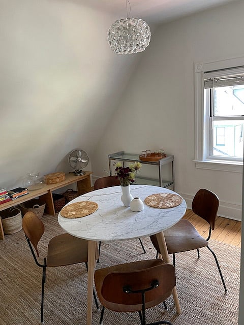 Charming dining area seats 4 with round marble table