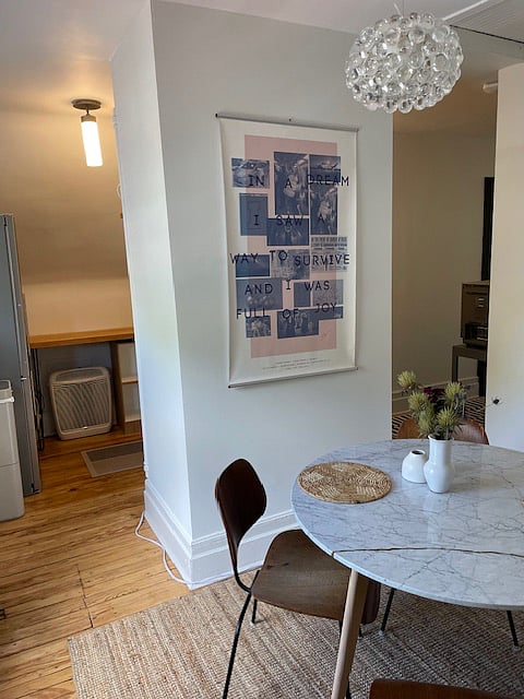 Dining area flows around kitchenette and hallway