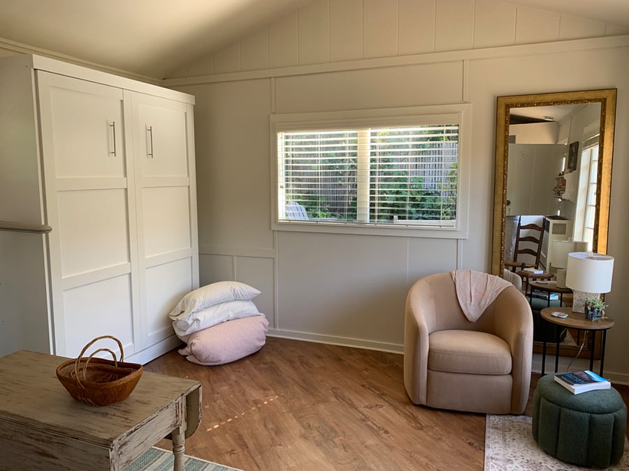 Studio area with the Murphy bed put up and away
