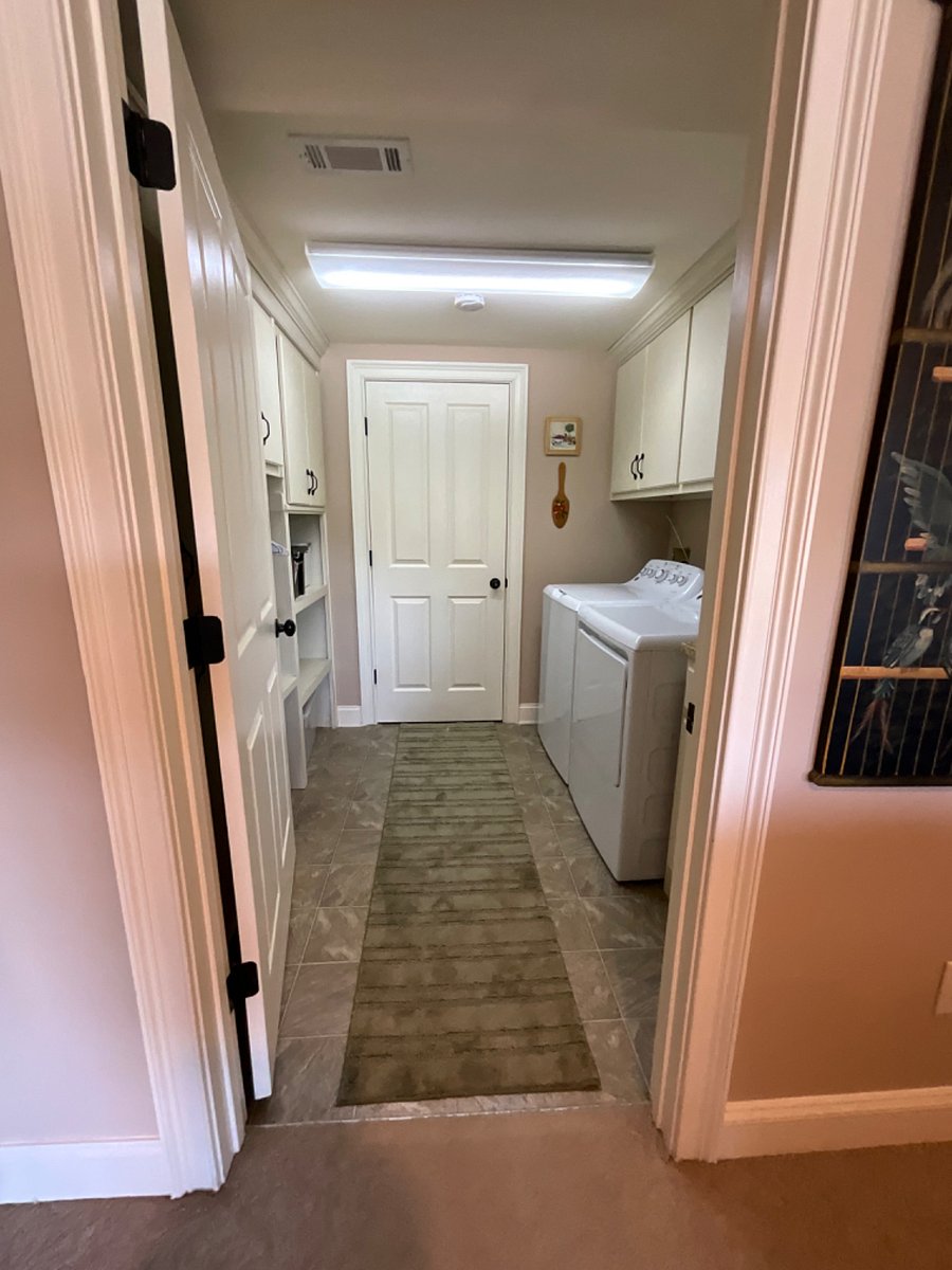 Laundry room with full sized washer and dryer.