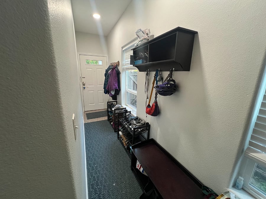 Entryway with coat rack, mail/key/general "walking in the house" storage, reusable grocery bags, shoe area