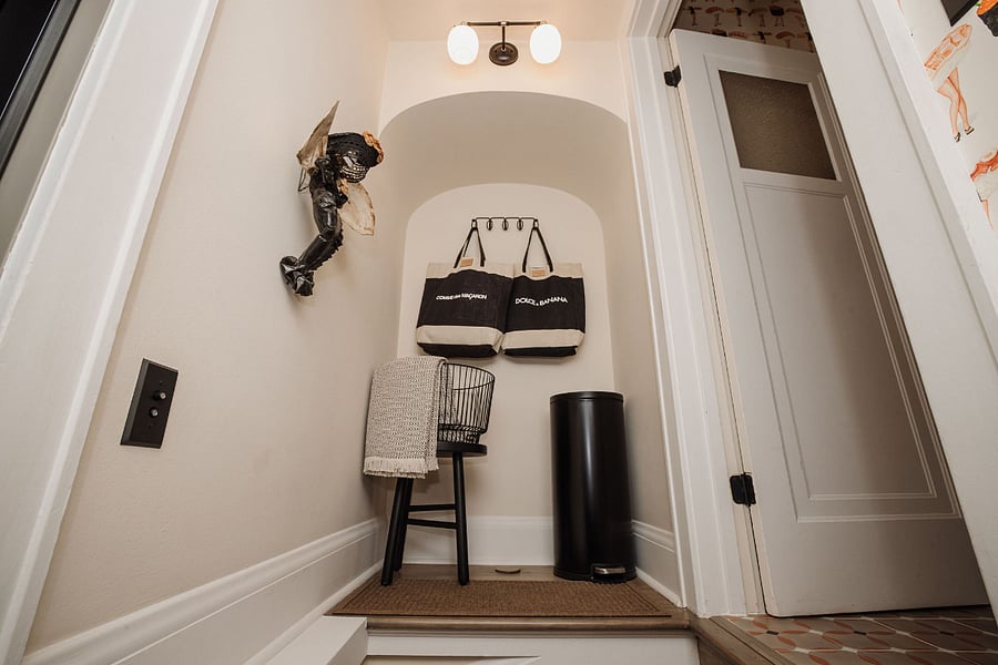 Just as you enter the back door, you meet the staircase which leads up to my unit and down to yours. 