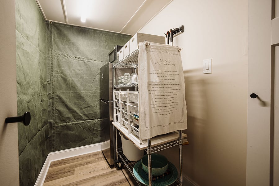 Just down the hall, before entering the living and sleeping area, is a pantry with a full range of supplies, refrigerator/freezer and microwave.