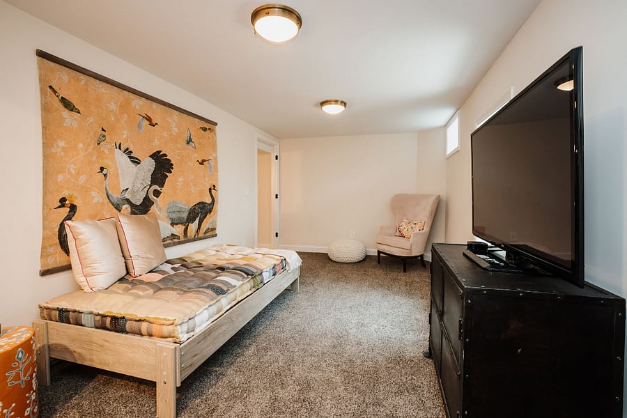 Lovely living room with daybed. There are linens to add to the daybed for sleeping. The office is built into this room. The door to this living room has a keyed lock. Through the open doorway is the bedroom, closet & en suite bath.