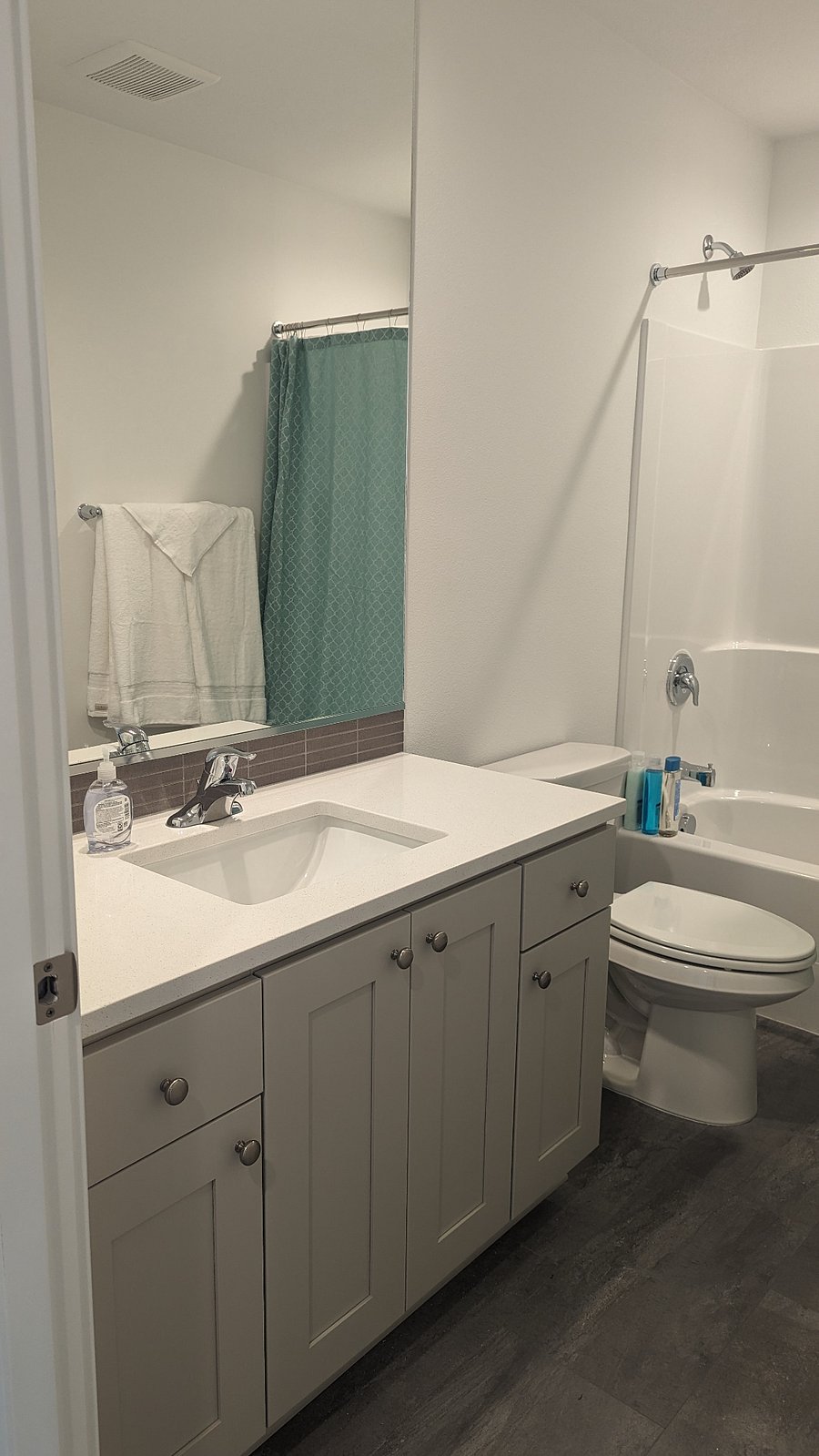 Shared bathroom with tub and shower for the second and third bedrooms