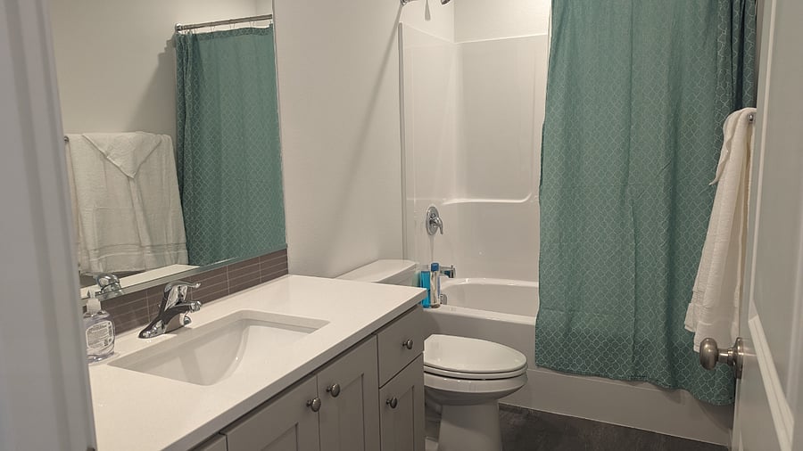 Shared bathroom with tub and shower for the second and third bedrooms