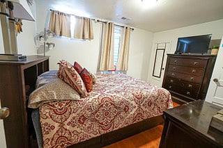 (1) Bedroom with closet for storage, Robes, Iron Board, Pillows, Beach Towels, Folding Laptop Desk, Fan and Humidifier.  