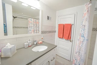 Bathroom stocked with essentials such as: Towels,   Body Wash, Toothbrushes, Deodorant, Blow Dryer, Bedding Sheets and First Aid Kit. 