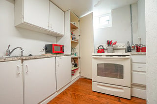Kitchen stocked with essentials such as Coffee, Tea, Sugar, Seasoning, and Water.  It also includes Waffle Maker, Air Fryer, Crock Pot, Toaster, Coffee Grinder, Dishwashing Soap, Paper towels and a Complimentary Gift. 