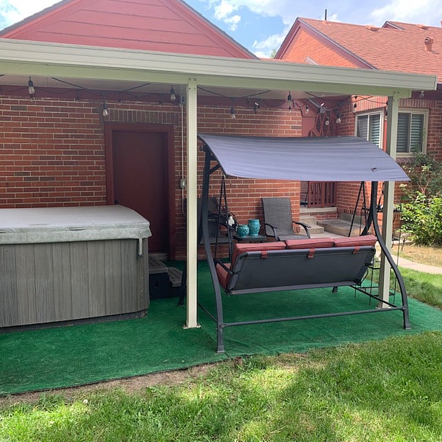 Backyard with Patio furniture and Swing. 