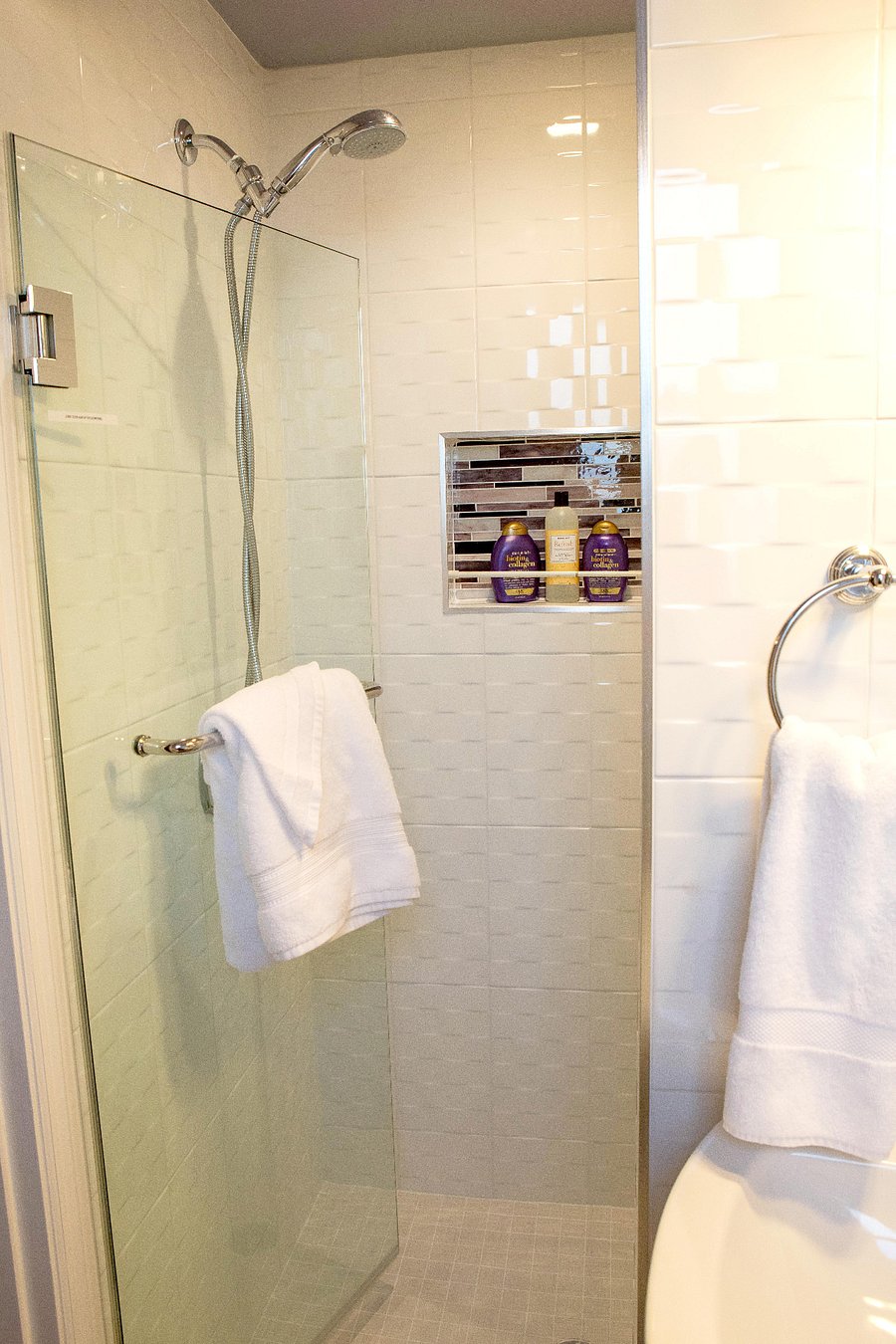 Walk in shower with glass enclosure