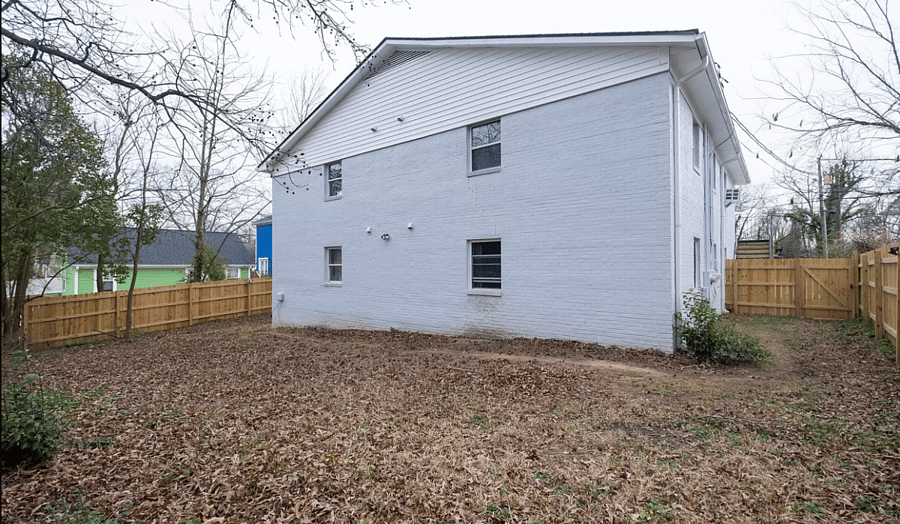 Fenced in backyard with gate that requires a code to get in.