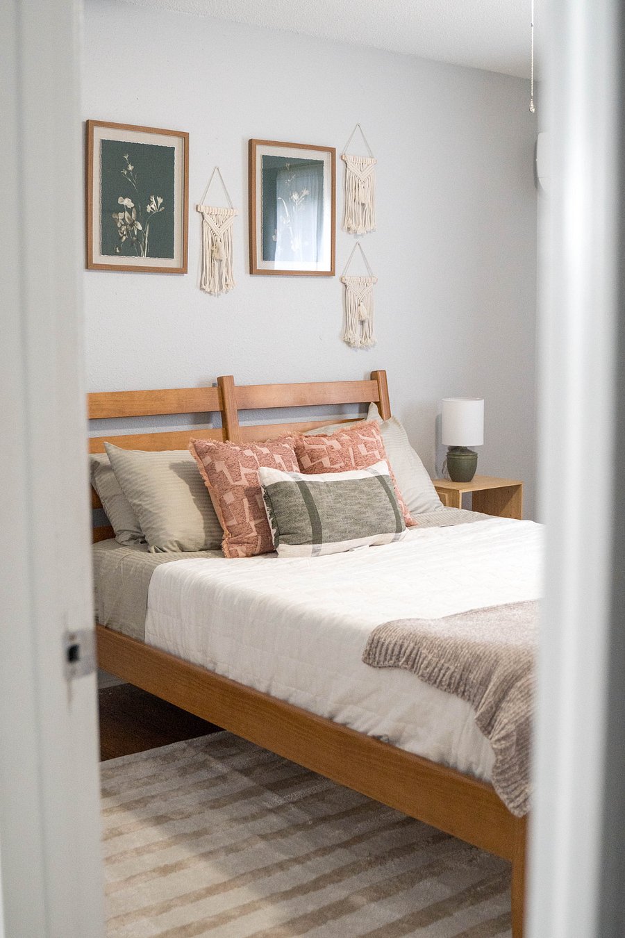 Gorgeous boho bedroom with blackout curtains and sound machine.