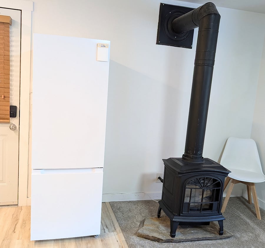 Full size frig/freezer and gas stove fireplace for a very cozy living area. The stove is in addition to central heat and a/c which has it's own thermostat accessible from inside your unit.