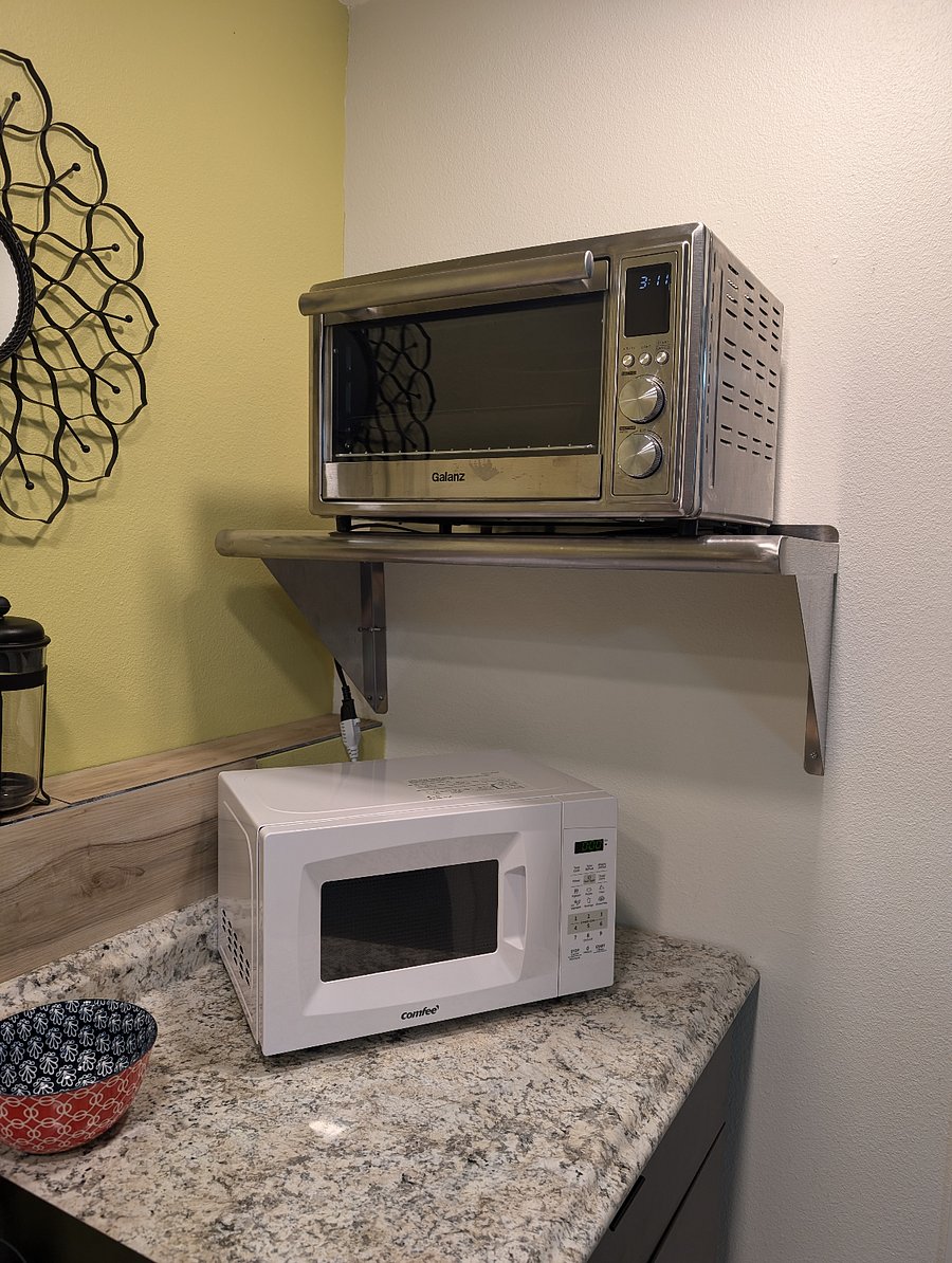 New white microwave and large toaster oven with loads of new features.