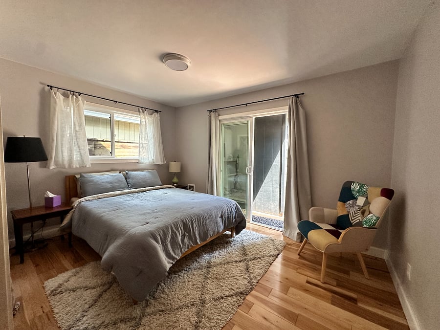 Bedroom 2 (of 4) with queen sized bed, large closet and access to back porch