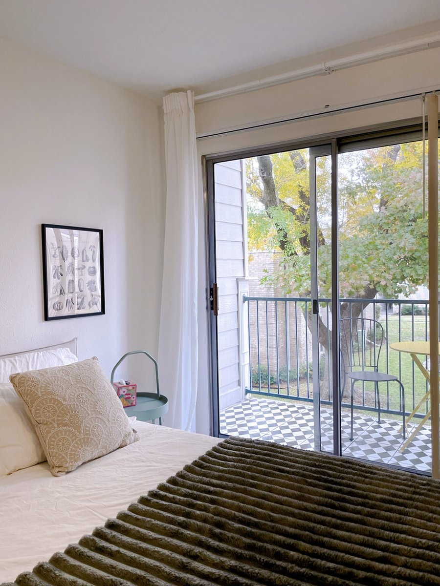 Bedroom includes darkening curtain, perfect for a restful night's sleep or a cozy afternoon nap.