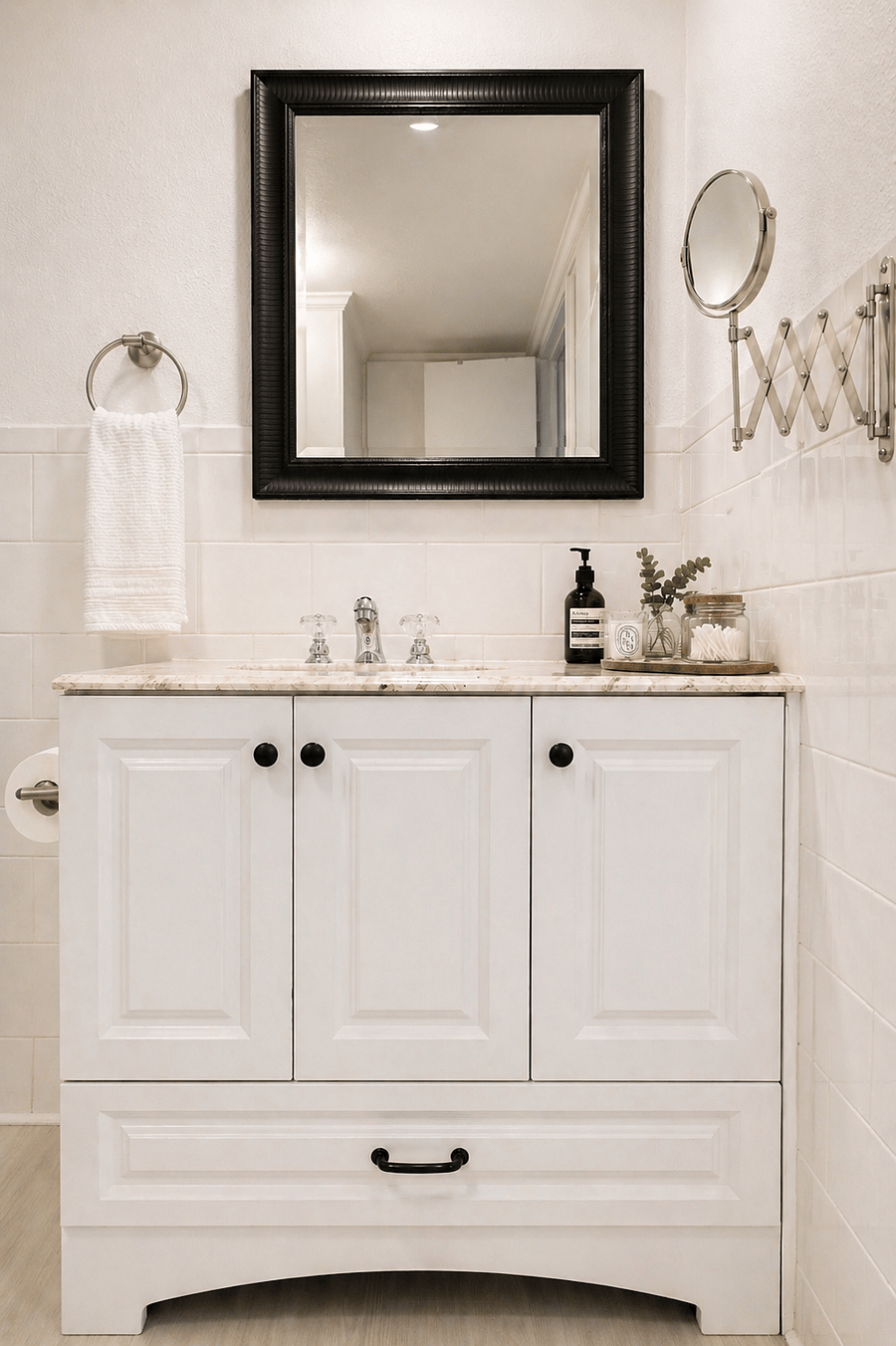 Clean, light-toned vanity with a marble countertop and ample storage, including a full wall cabinet behind the door.