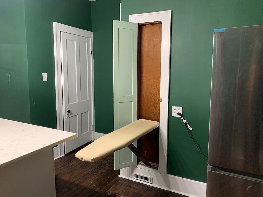 Murphy-style original ironing board with iron available.