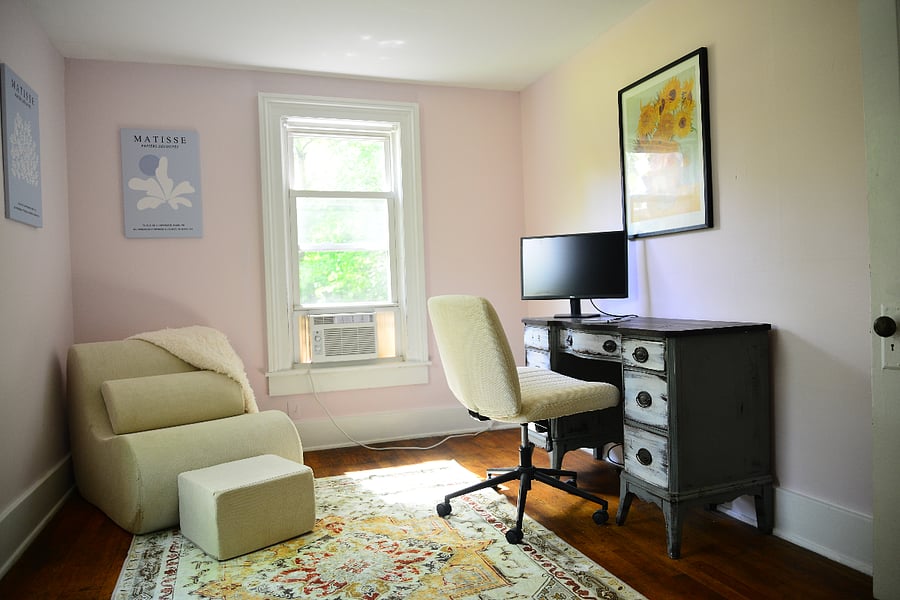 Dedicated workspace, with extra monitor provided, tucked in quiet corner of the townhouse. 
