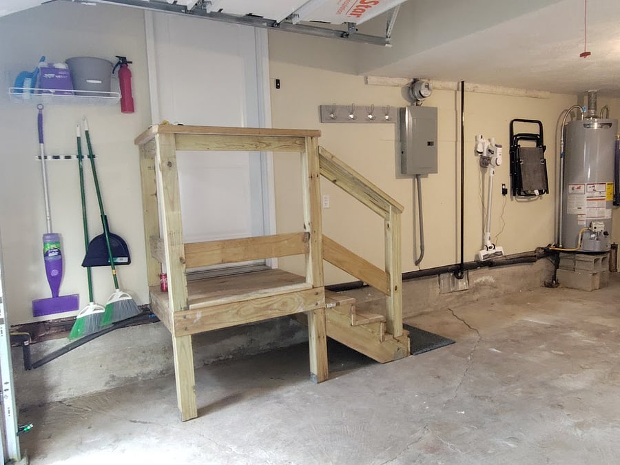 Roomy garage with extra storage space, vacuum, floorcare supplies