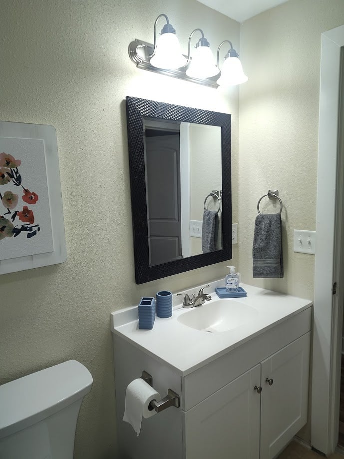 Hall Bath Vanity, plenty of towels and bath sheets, cleaning supplies hair dryer included

