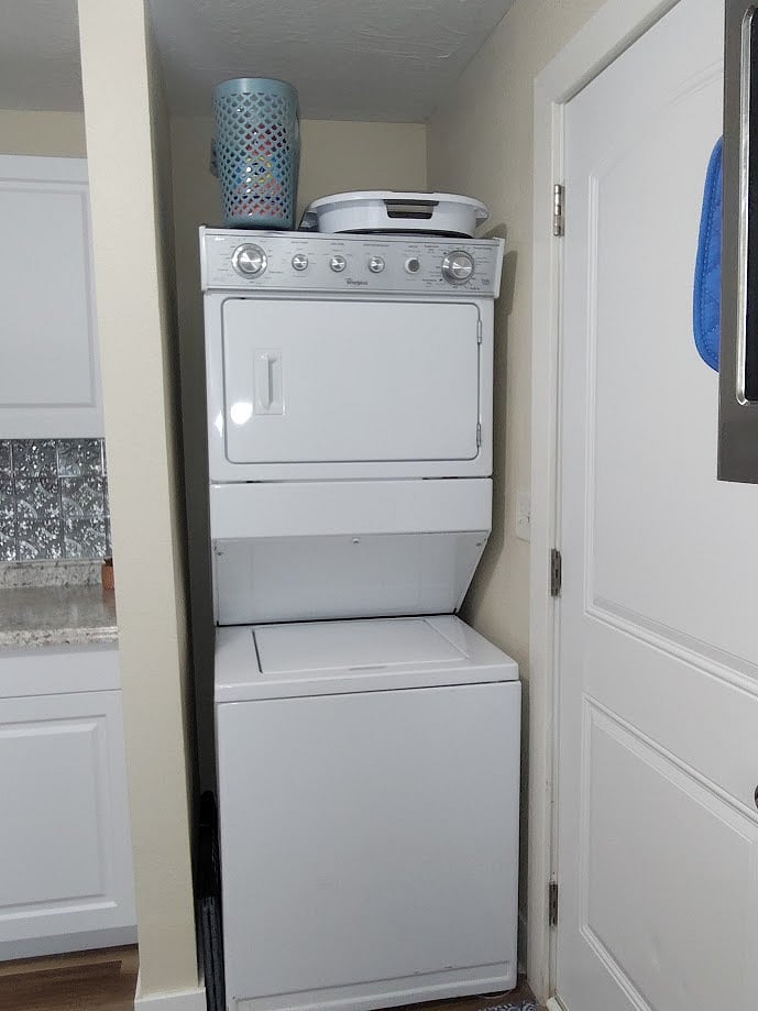 Laundry Station in unit with washer, dryer and starter supplies