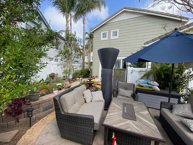 Backyard with patio furniture, fire pit, and gas BBQ. And area to garden if you like!