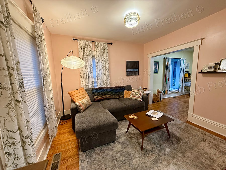 Living room, main floor, couch does convert to sleeping area if needed.