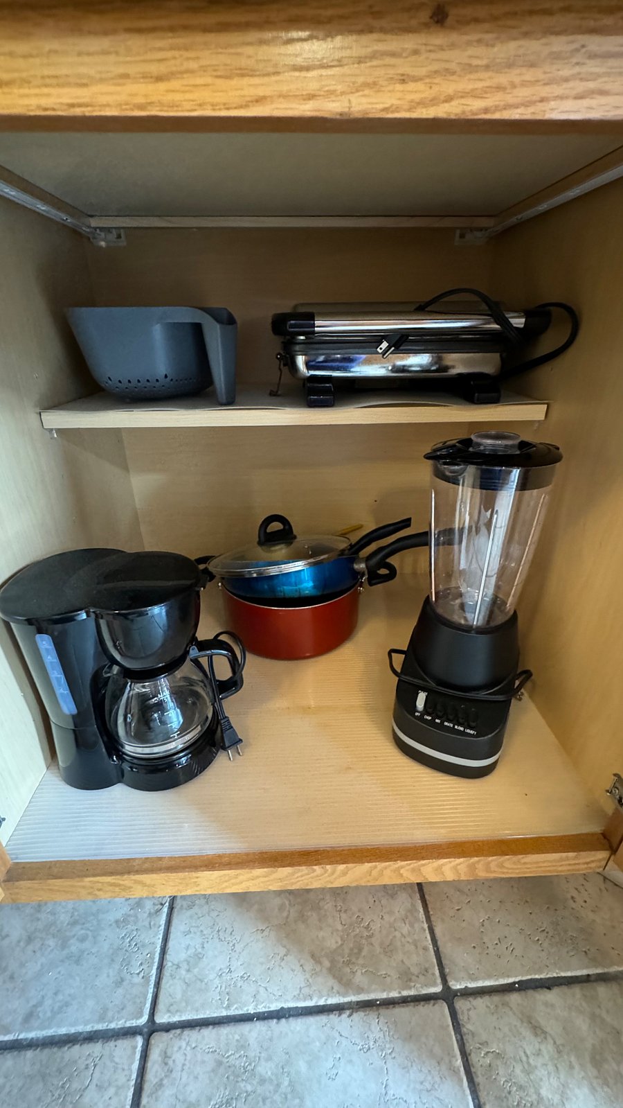 Drip coffee pot, blender, pots, pans, colander and panni press.