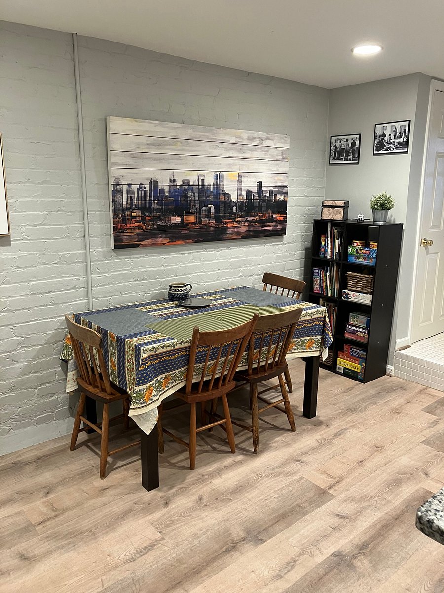 Dining area. Table can be expanded. Bookshelf with games.