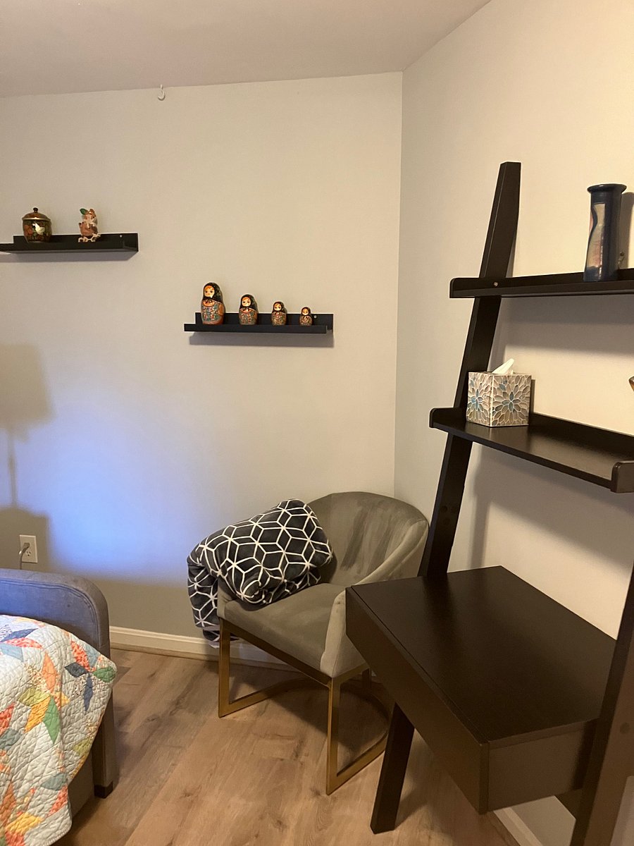 Bedroom 2 with twin trundle bed, view of small desk and chair.
