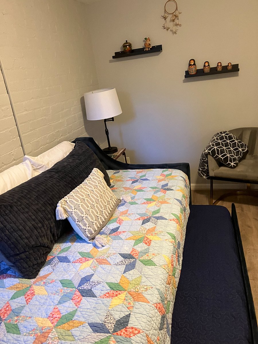 Bedroom 2: Twin trundle daybed. Lower twin bed pulled out from underneath.