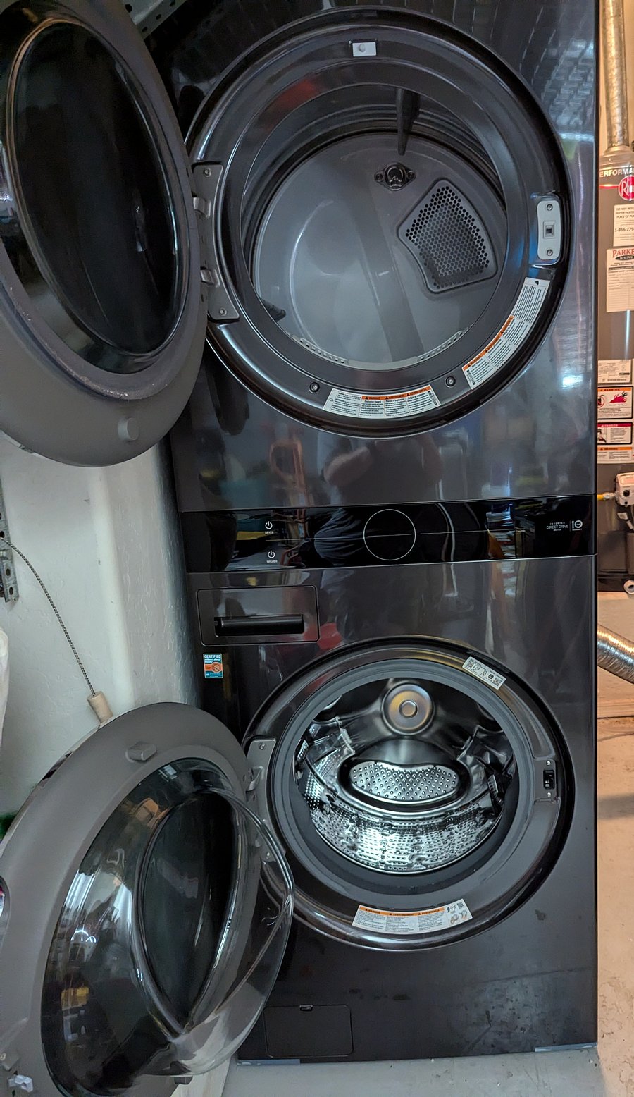 Stacked washer and dryer in garage